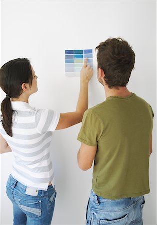 Couple Looking at Paint Samples Stock Photo - Premium Royalty-Free, Code: 600-01838270