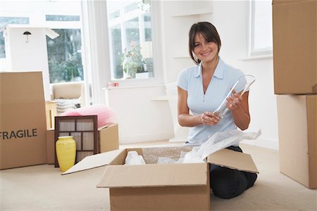 real estate people eye contact - Woman Packing Boxes Stock Photo - Premium Royalty-Free, Code: 600-01838307