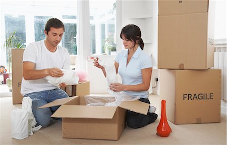 Couple Packing Boxes Stock Photo - Premium Royalty-Free, Code: 600-01838312