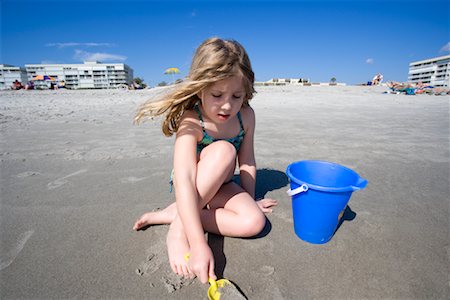 dig sand - Girl Playing on Beach Stock Photo - Premium Royalty-Free, Code: 600-01879134