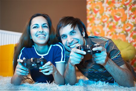 Couple Playing Video Games Stock Photo - Premium Royalty-Free, Code: 600-01879511