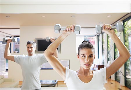 simsearch:700-02071519,k - Couple Exercising in Home Stock Photo - Premium Royalty-Free, Code: 600-01954792