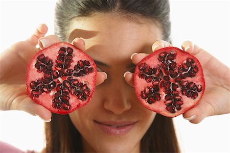 fruit eyes not children - Woman Holding Pomegranate Stock Photo - Premium Royalty-Free, Code: 600-01954847