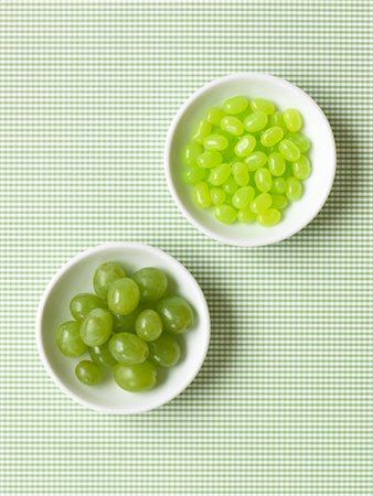 Grapes and Jelly Beans in Bowls Stock Photo - Premium Royalty-Free, Code: 600-01955473