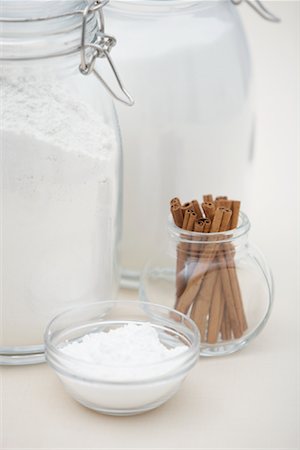 Icing Sugar, Flour, White Sugar and Cinnamon Sticks in Glass Containers Stock Photo - Premium Royalty-Free, Code: 600-01955566