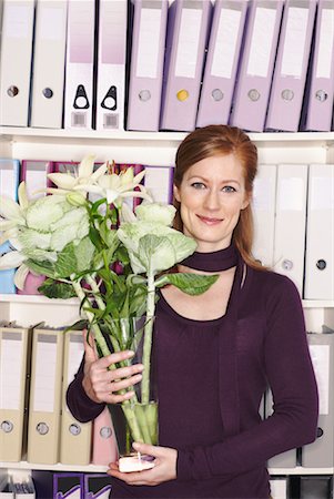 Businesswoman Holding Flower Vase Stock Photo - Premium Royalty-Free, Code: 600-01956067