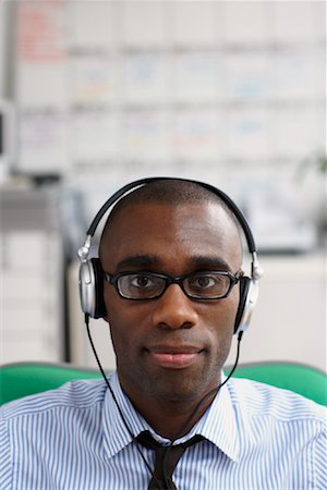 Businessman Wearing Headphones Stock Photo - Premium Royalty-Free, Code: 600-01956090