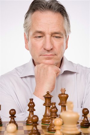 simsearch:600-01788481,k - Man Playing Chess Photographie de stock - Premium Libres de Droits, Code: 600-01953766