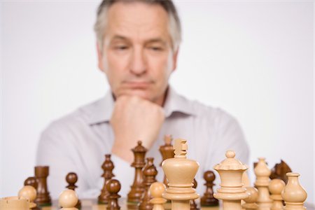 simsearch:700-00031145,k - Man Playing Chess Fotografie stock - Premium Royalty-Free, Codice: 600-01953767