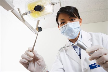 female vacuuming asian - Dentist at Work Stock Photo - Premium Royalty-Free, Code: 600-01993017
