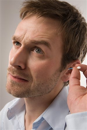 Man Cleaning Ears Foto de stock - Sin royalties Premium, Código: 600-02010055