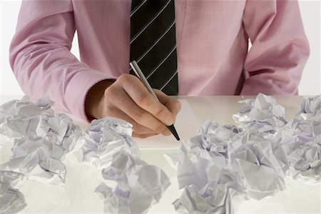 Businessman Surrounded by Crumpled Paper Fotografie stock - Premium Royalty-Free, Codice: 600-02010541