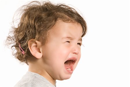 frustrated child white background - Little Girl Crying Stock Photo - Premium Royalty-Free, Code: 600-02038130