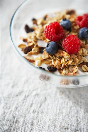 simsearch:600-05947686,k - Bowl of Cereal with Raspberries and Blueberries Stock Photo - Premium Royalty-Free, Code: 600-02033711