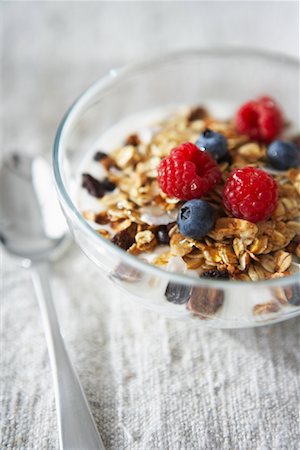 simsearch:600-05947693,k - Bowl of Cereal with Raspberries and Blueberries Stock Photo - Premium Royalty-Free, Code: 600-02033712