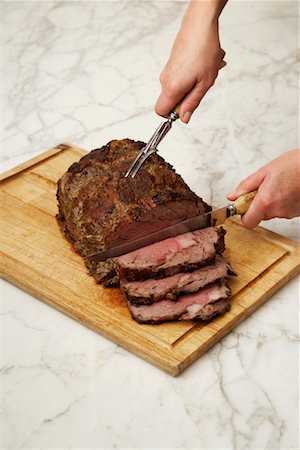 Hands Carving Roast Beef Foto de stock - Sin royalties Premium, Código: 600-02046232