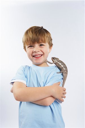 Boy with Lizard on Shoulder Stock Photo - Premium Royalty-Free, Code: 600-02055791