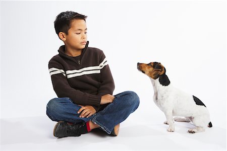 puppy with child white background - Boy with Dog Stock Photo - Premium Royalty-Free, Code: 600-02055848