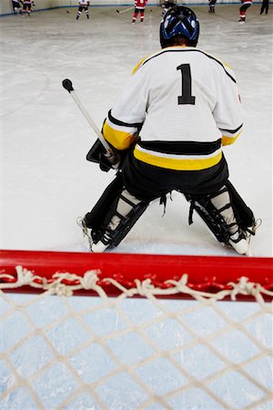 simsearch:600-02056071,k - Rear View of Goalie During Hockey Game Stock Photo - Premium Royalty-Free, Code: 600-02056054