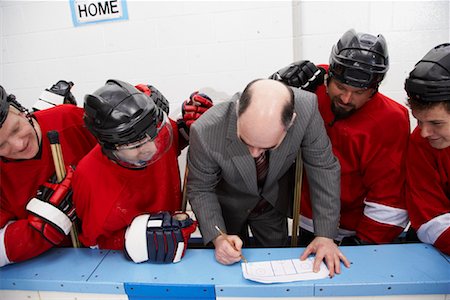 Coach Going Over Game Plan Stock Photo - Premium Royalty-Free, Code: 600-02056083