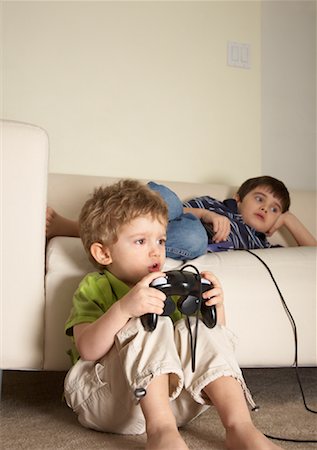 Boys Playing Video Games Stock Photo - Premium Royalty-Free, Code: 600-02056472