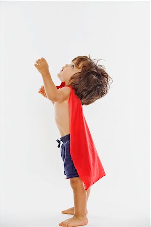 super héroe - Little Boy Wearing Red Cape Foto de stock - Sin royalties Premium, Código: 600-02056595