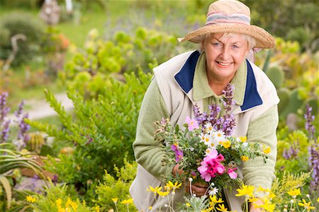 flower bending over - Portrait of Woman in Meadow, Collecting Flowers Stock Photo - Premium Royalty-Free, Code: 600-02071247