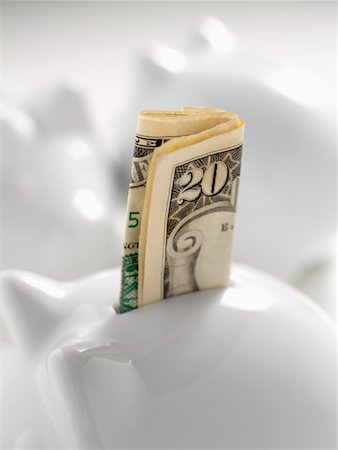 American Currency in Piggy Bank Stock Photo - Premium Royalty-Free, Code: 600-02071257