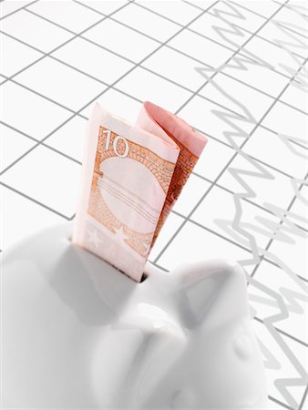 full piggybank - Euro Note in Piggy Bank Stock Photo - Premium Royalty-Free, Code: 600-02071260
