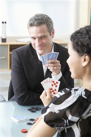 playing cards with photos male - Business People Playing Poker Stock Photo - Premium Royalty-Free, Code: 600-02081683
