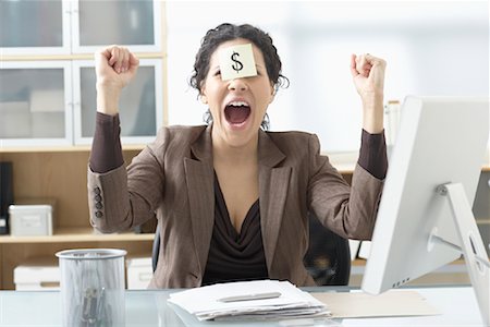 Businesswoman Sitting at Desk with Self Adhesive Note on Forehead Stock Photo - Premium Royalty-Free, Code: 600-02081731