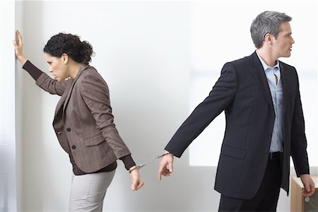 Businessman and Businesswoman Handcuffed Together Stock Photo - Premium Royalty-Free, Code: 600-02081770