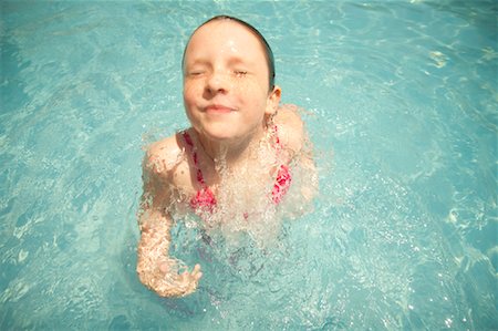 Girl Emerging from Underwater Foto de stock - Sin royalties Premium, Código: 600-02082094