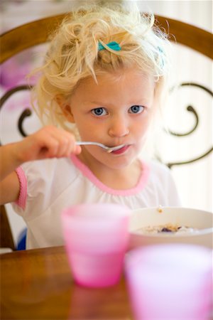 Girl Eating Breakfast Stock Photo - Premium Royalty-Free, Code: 600-02125488