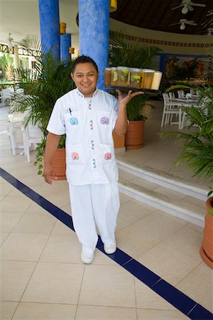 room service waiters uniforms - Waiter Carrying Tray of Drinks, Mexico Stock Photo - Premium Royalty-Free, Code: 600-02121230