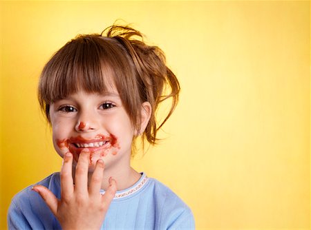 delicious - Portrait of Girl With Spaghetti Sauce on Face Stock Photo - Premium Royalty-Free, Code: 600-02123741