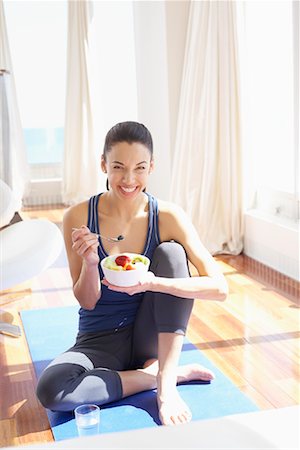 simsearch:600-02130675,k - Woman on Yoga Mat with Bowl of Fruit Stock Photo - Premium Royalty-Free, Code: 600-02130659