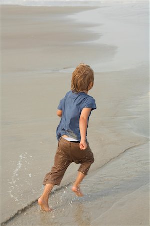 Boy Running on Beach Stock Photo - Premium Royalty-Free, Code: 600-02156915