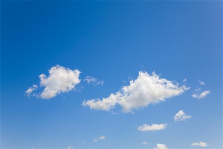 Puffy Clouds in Sky Foto de stock - Sin royalties Premium, Código: 600-02159043
