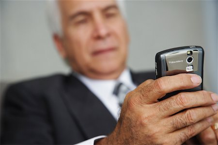 Businessman using Electronic Organizer Stock Photo - Premium Royalty-Free, Code: 600-02199799