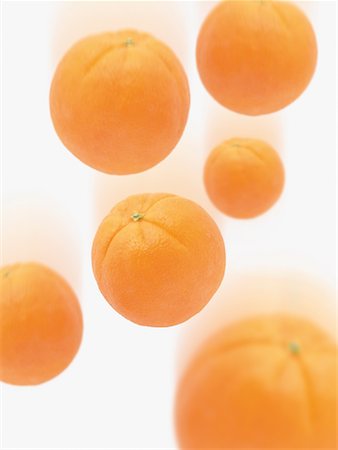 falling fruit white background - Falling Oranges Stock Photo - Premium Royalty-Free, Code: 600-02193899