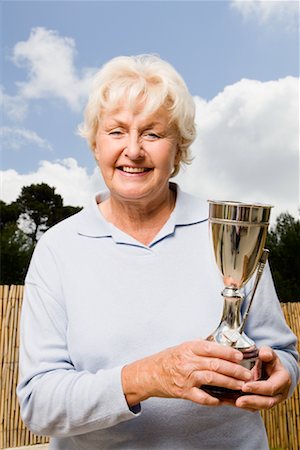 single old woman - Woman Holding Trophy Foto de stock - Sin royalties Premium, Código: 600-02193915