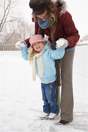 Mother Teaching Daughter to Skate Stock Photo - Premium Royalty-Free, Code: 600-02200071