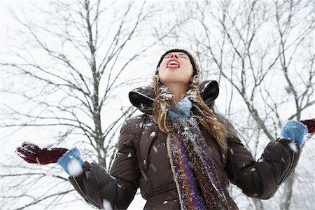 sticking out tongue in snow - Woman Catching Snowflakes on her Tongue Stock Photo - Premium Royalty-Free, Code: 600-02200106