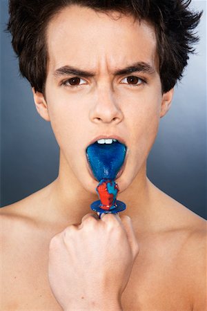 Portrait of Man Eating Candy Stock Photo - Premium Royalty-Free, Code: 600-02200147