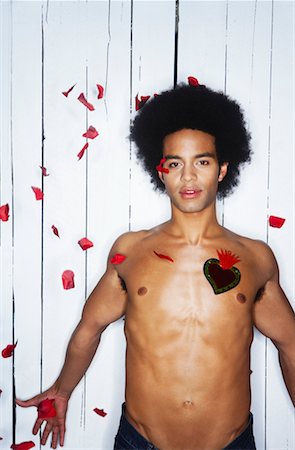 fallen hair - Rose Petals Falling on Man With Heart on Chest Stock Photo - Premium Royalty-Free, Code: 600-02200273