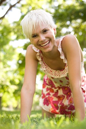 Portrait of Woman on Hands and Knees Outdoors Stock Photo - Premium Royalty-Free, Code: 600-02201197