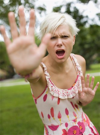 scared young woman one not man not asian - Young Angry Woman Making Hand Gesture in Defence Stock Photo - Premium Royalty-Free, Code: 600-02201206