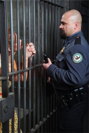 desperate - Woman Talking to Prison Guard Stock Photo - Premium Royalty-Free, Code: 600-02201335