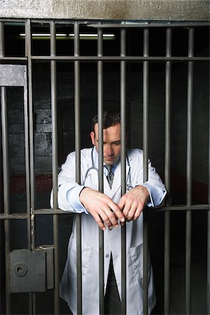 Doctor in Prison Stock Photo - Premium Royalty-Free, Code: 600-02201359